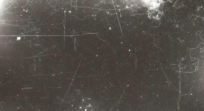 Old film scratch and dust overlay texture on black background