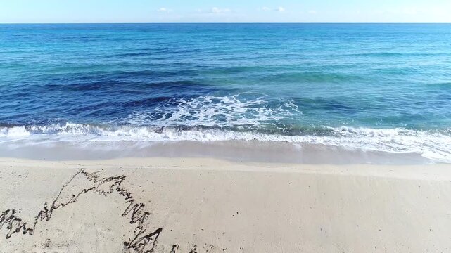 Waves coming to the beach
Shore of a beach while the small waves of the sea arrive creating white foam on the sand, on a clear day and the horizon in the background as a straight line that separates t