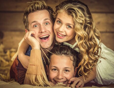 A heartwarming family portrait of three siblings playfully embracing