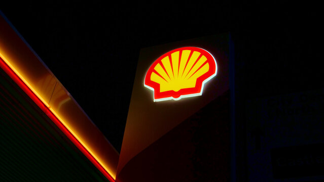 Leicester, England, UK - 4 May 2026: Shell gas station sign at night, glowing fuel company logo billboard, illuminated petrol station corporate identity