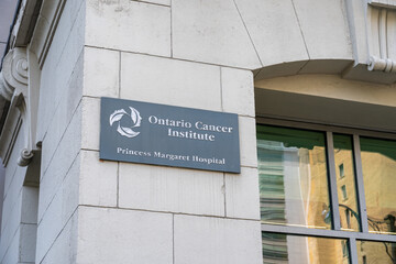 Naklejka premium Toronto, Ontario, Canada - June 2, 2026: The sign marks the Ontario Cancer Institute on the building of Princess Margaret Hospital in Toronto, Ontario, Canada. 
