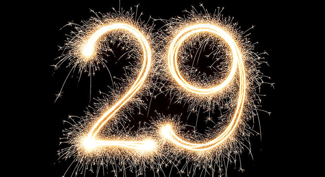Vibrant fireworks explosion creating illuminated number 29 against a dark background, ideal for celebrations or age-related themes.