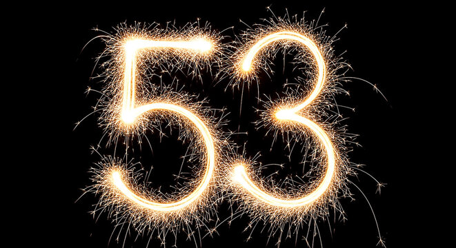 Dramatic close-up of glowing sparklers creating the illuminated number 53 for celebration or milestone marking.