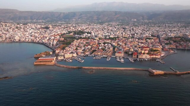 Beautiful Old city, Greece and best scenic places - panorama of picturesque old town Chania. Crete island, Panoramic of the old Venetian port and lighthouse during the blue hour, Travel Concepts
