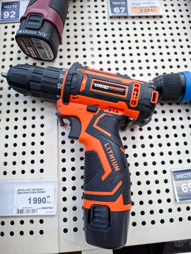 Voronezh, Russia - April 8, 2026.Cordless drill driver on display in Russian supermarket with price tags and shelves