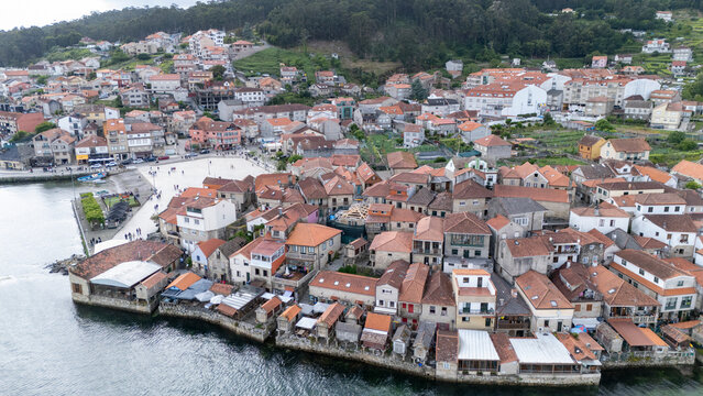 Combarro village view showing traditional h&oacute;rreos at a r&uacute;a do mar