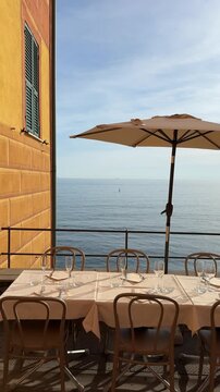 Dining by the sea in Camogli, Italy while enjoying the view of the water and sky