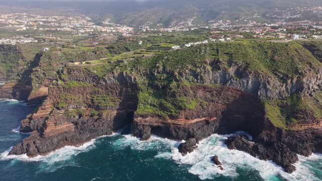 Aerial drone footage of the stunning coastal cliffs of Santa Ursula in North Tenerife, Spain, overlooking the Atlantic Ocean