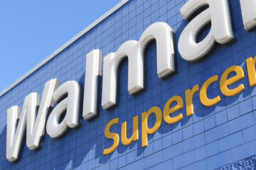 Obraz premium detail of exterior building and sign of Walmart Supercentre, a department store chain, located here at 2525 St Clair Av W inside SmartCentres Toronto