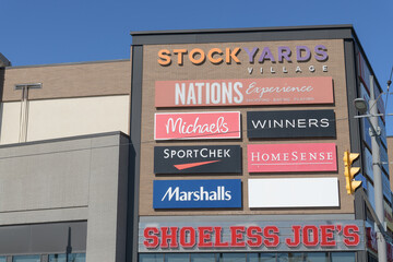 Naklejka premium wall with business signs at Stock Yards Village located at 1980 St Clair Av W, Toronto