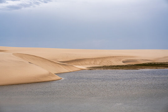 Dunes and lagoons of Atins, Lencois Maranhenses, Barreirinhas, Brazil. White sand dunes with pools of fresh water