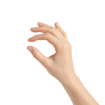 Fair female hand with slender manicured fingers pinching thumb and index finger in a studio against a transparent background precision and elegance concept