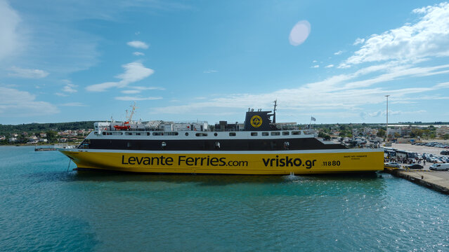Ferry on calm sea, blue sky, Kyllini harbor