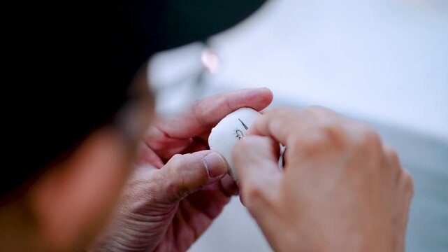 Hand cutting fabric pieces during handmade sewing workshop