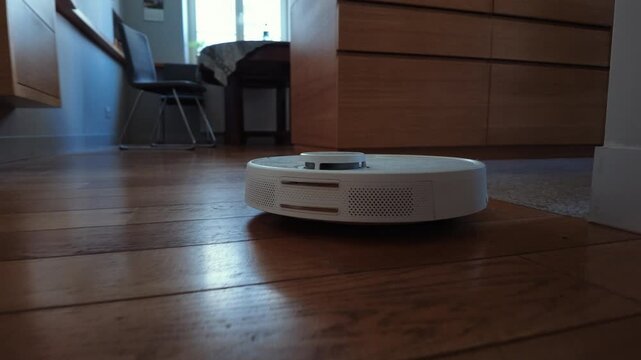 Robotic Vacuum Cleaner Cleaning Home Floor
