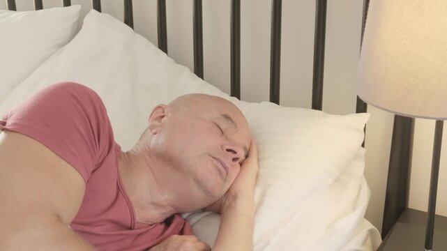 senior man rests deeply, eyes closed and face serene, Nighttime struggles, sleep disruption, anxiety in older adult, quiet moment true rest, reminding healing begins body finally surrenders to sleep