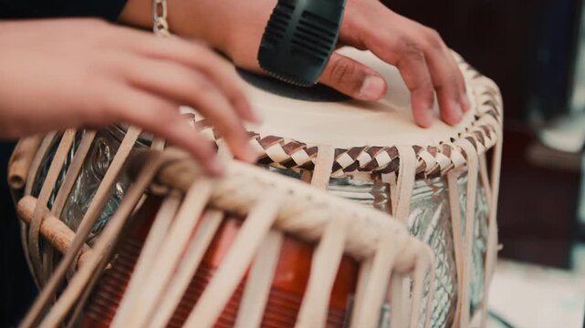 Musician plays Indian drum tabla during Vaisakhi festival
