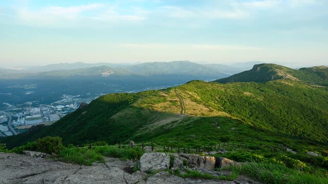 Mountain Ridge Overlooking Valley at Golden Hour Sunset Timelapse