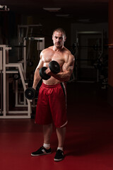 Fototapeta premium Healthy Young Man Doing Exercise For Biceps