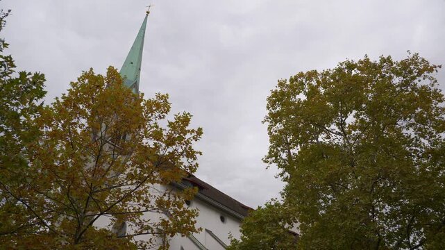 day time zurich city center famous church exterior up view slow motion panorama 4k switzerland