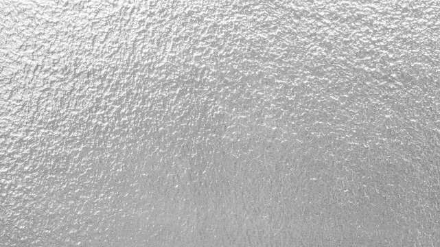 grainy silver foil gray metal surface texture 4k bright plain background 4k video