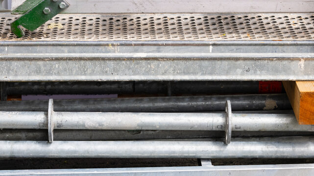 Metal scaffolding components creating textured industrial background