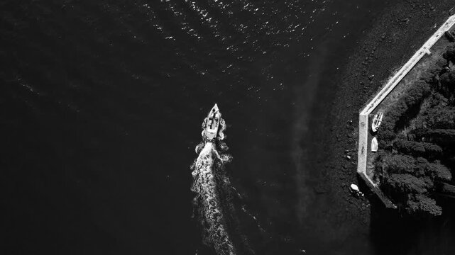 Mysterious maritime landscape featuring small craft through rocky straits