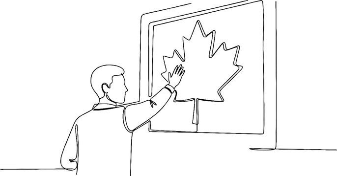 Person interacting with large maple leaf display.