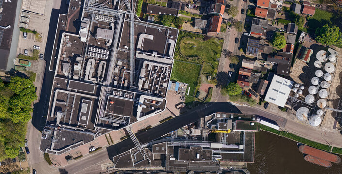 Wormer, Netherlands - 02 June 2026: Aerial view of the Cargill cocoa factory Gerkens at the Zaan river, showing the over-water transport system for half products and industrial rooftops.