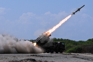 Fototapeta premium A missile launcher fires rockets during active military operations amid the ongoing Ukraine Russia conflict and the escalating Iran Israel military confrontation raising global fears of wider war