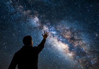 Obraz premium 夜空に手を伸ばす人 | A person reaching out to the night sky Generative AI