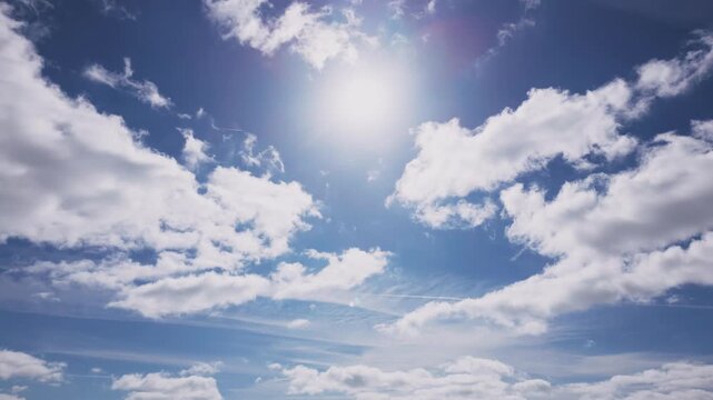 Sunny blue sky with partial clouds covering