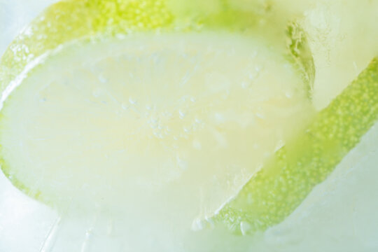 Fresh lime slices and ice cubes