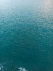 Calm blue sea water with gentle ripples creating a natural ocean texture, ideal as a peaceful marine background for travel, nature, or design projects. © Antonius