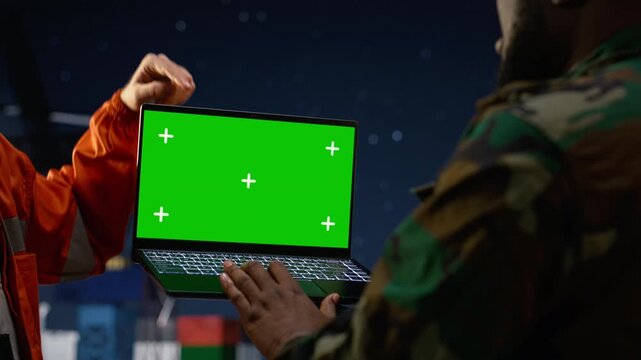 Chroma key laptop, enforce maritime embargo protocol and army unit on drilling rig with green screen laptop mockup.