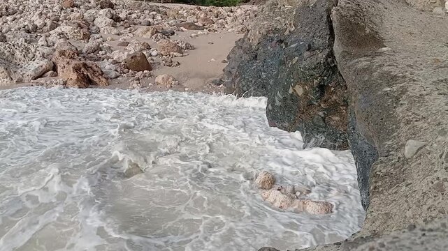 Powerful Ocean Waves Crashing on Stony Beach and Big Rocks
