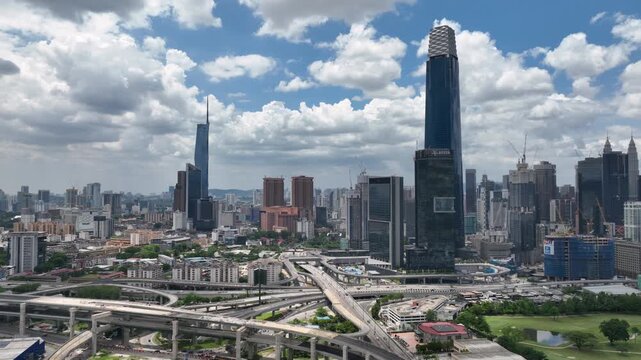 sunny day flight over kuala lumpur city center traffic road interchange aerial panorama 4k malaysia  