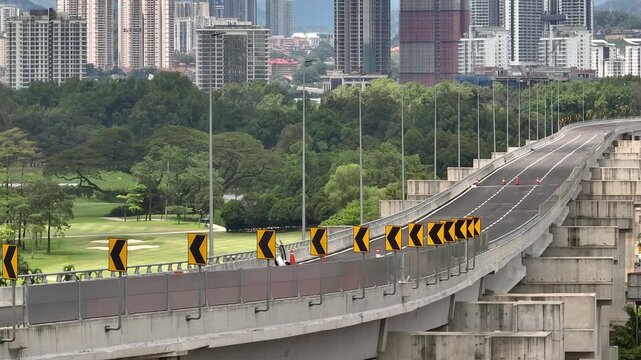 day time kuala lumpur city traffic street road overpass golf court park background aerial panorama 4k malaysia  