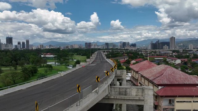 day time kuala lumpur city traffic street road overpass golf court park background aerial panorama 4k malaysia  