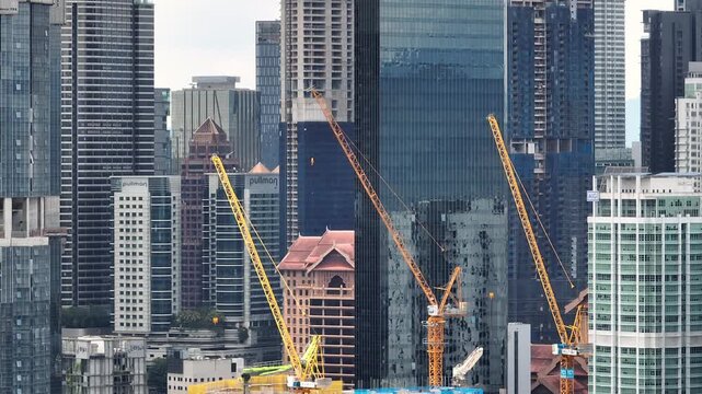 day time kuala lumpur city downtown exterior construction site rooftop aerial panorama 4k malaysia 