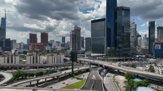 sunny day flight over kuala lumpur city center traffic street road interchange aerial panorama 4k malaysia   