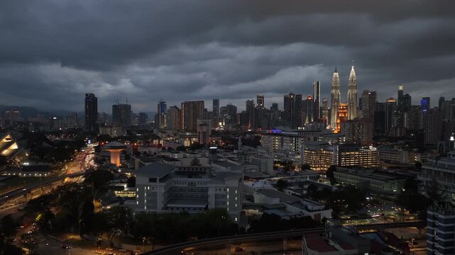 twilight time illumination flight over kuala lumpur city traffic road downtown exterior aerial panorama 4k malaysia    