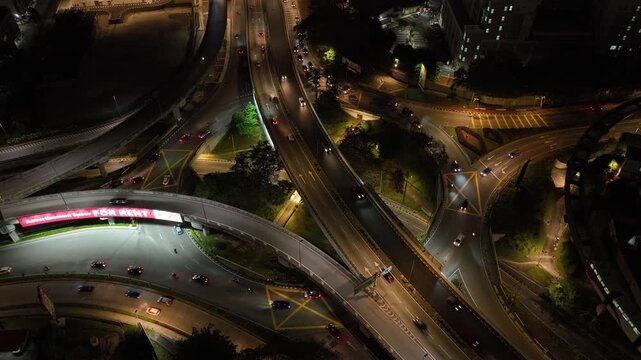 night illumination flight over kuala lumpur city traffic street road interchange aerial topdown panorama 4k malaysia  