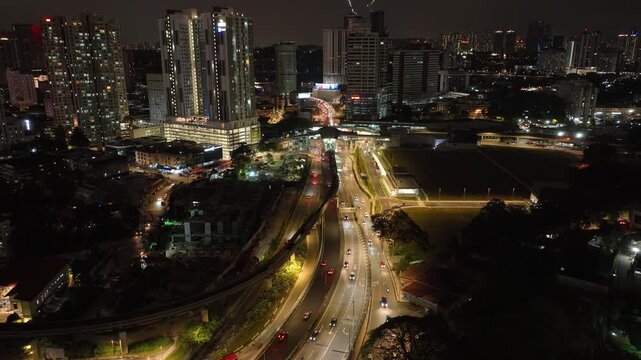 night time illuminated kuala lumpur city traffic street road aerial panorama 4k malaysia    