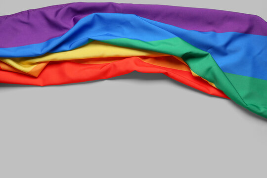 Rainbow flag on grey background. LGBT concept