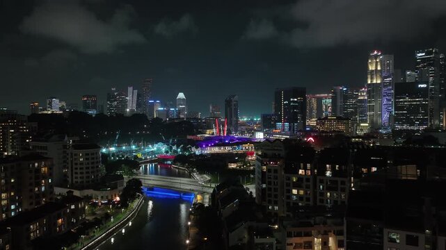 night life time singapore city famous riverside boat quay traffic bridge aerial panorama 4k 