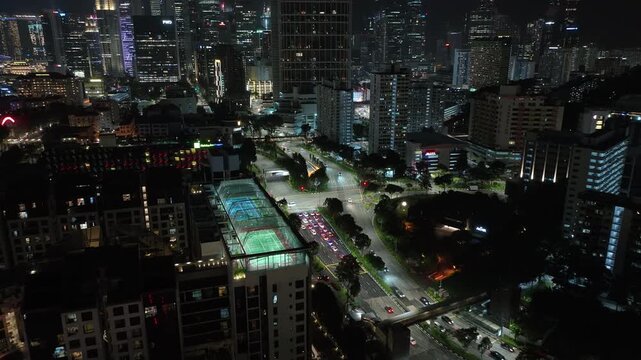 night time illumination singapore city downtown traffic street crossroad aerial panorama 4k 