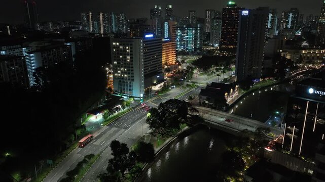 night time illumination singapore city center traffic street crossroad aerial topdown panorama 4k 