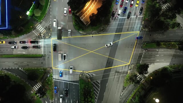 night life time singapore city center traffic street crossroad aerial topdown panorama 4k 