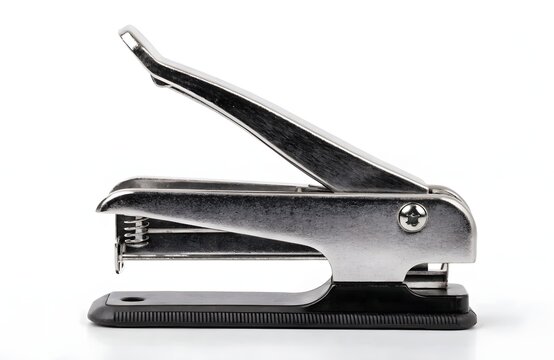 Modern metal stapler open on white isolated background minimalist office supply